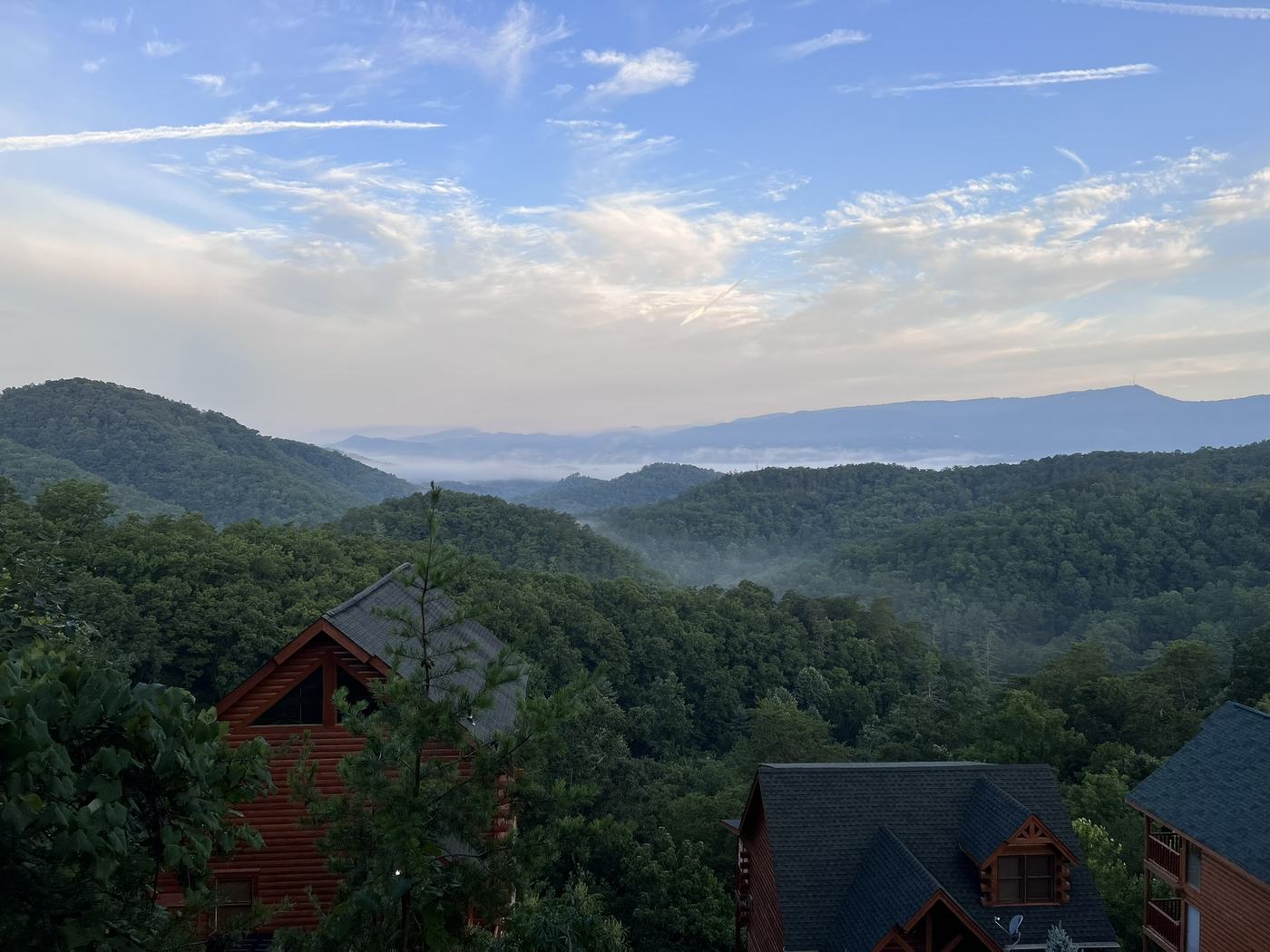 Smoky Mountain cabin view with morning mist